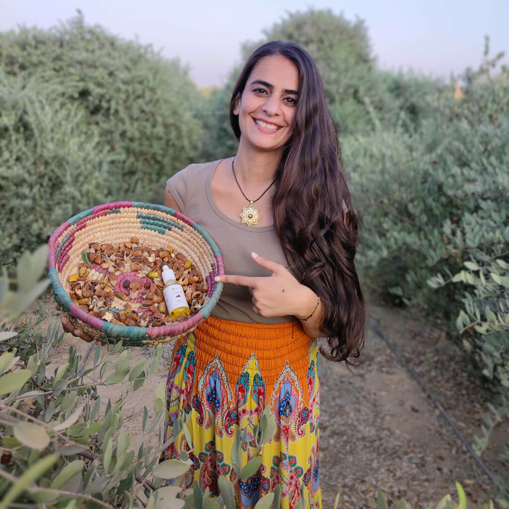 Monica holding a Jojoba oil